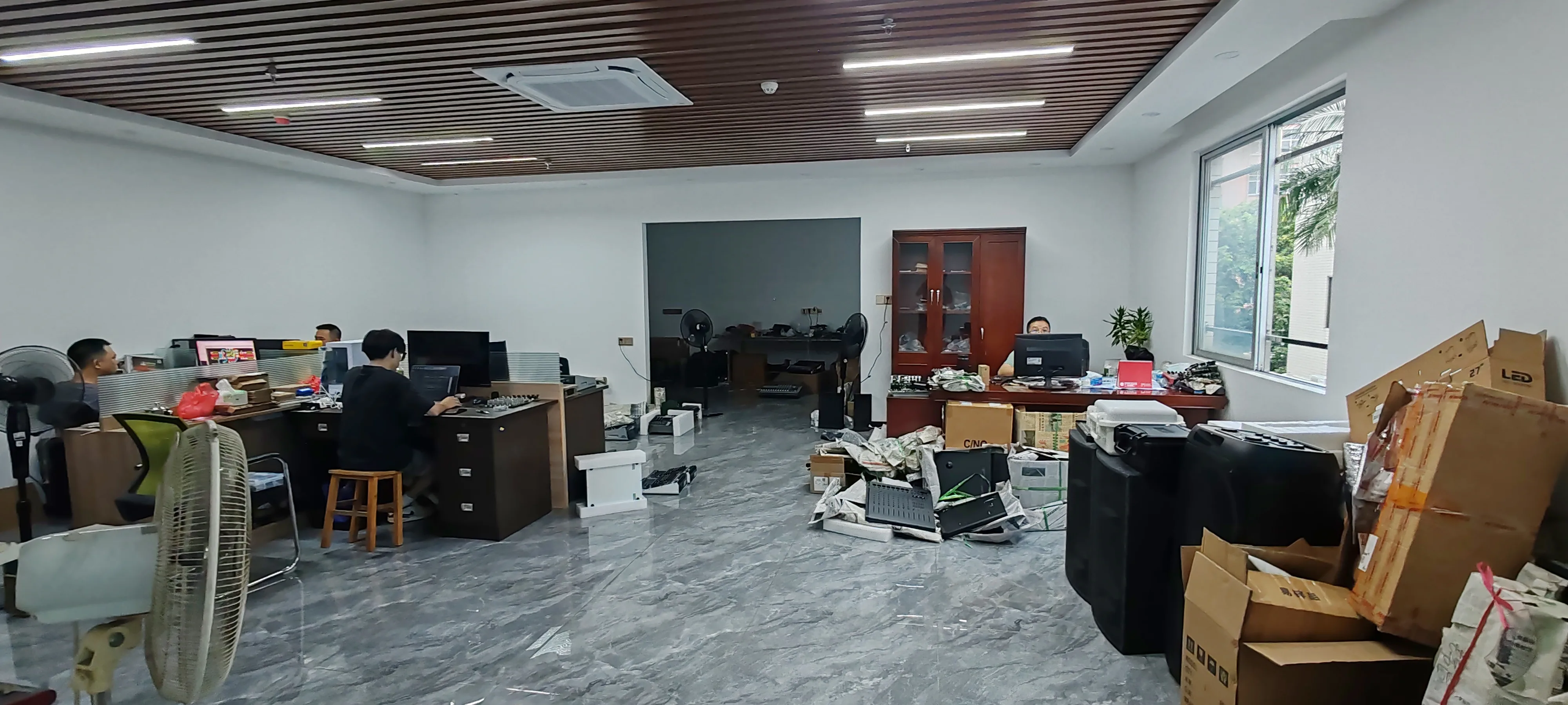 Electroacoustic Engineering Headquarters & R&D Workstation Suite Spacious ELM Audio engineering and office headquarters with computer workstations, sample speaker cabinets, and technical prototypes